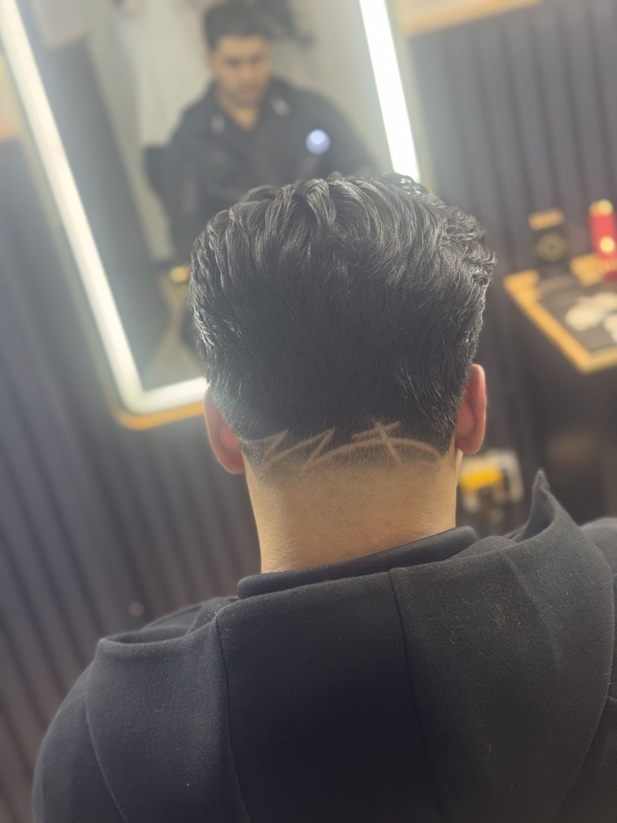 Detailed line work haircut at Ibra Barbershop